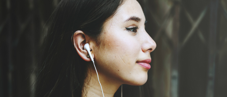 A woman wearing headphones.