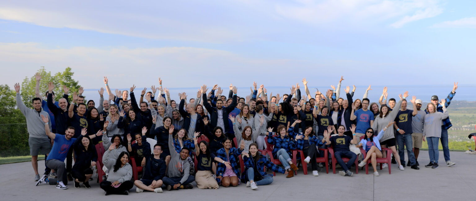 Coworkers pose for a team photo