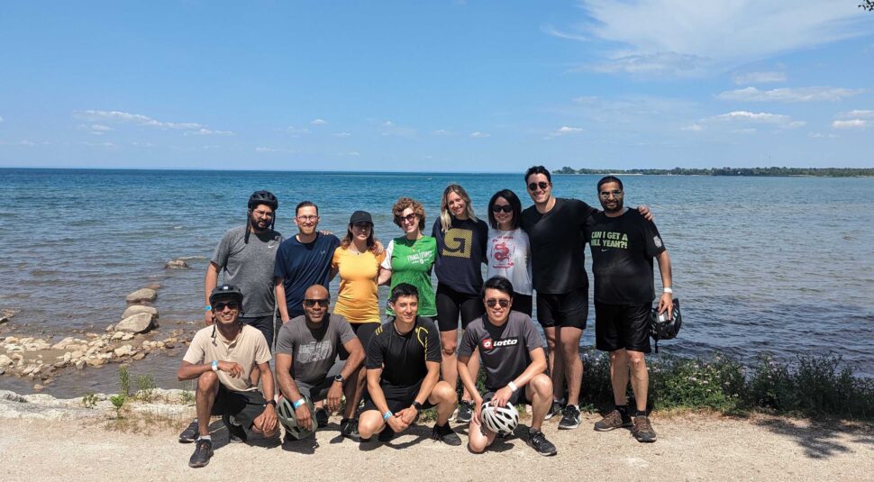 Co-workers pose a photo near the lake during the Georgian summer offsite