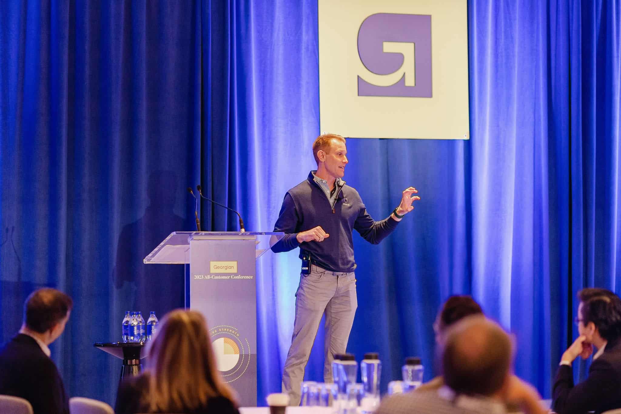 An employee speaking at the Georgian All-Customer Conference